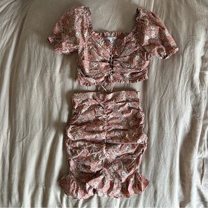 Rushed skirt and matching puff sleeve top with lace up detail